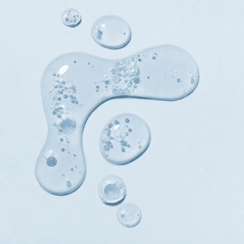 Macro close-up of clear hypochlorous acid mist beading into droplets