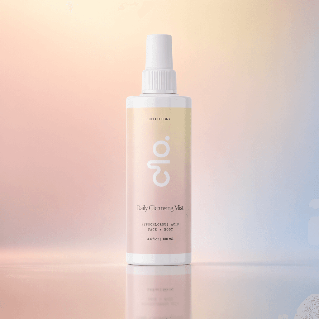 Clo Daily Cleansing Mist bottle on a travertine shelf with soft geometric shadows