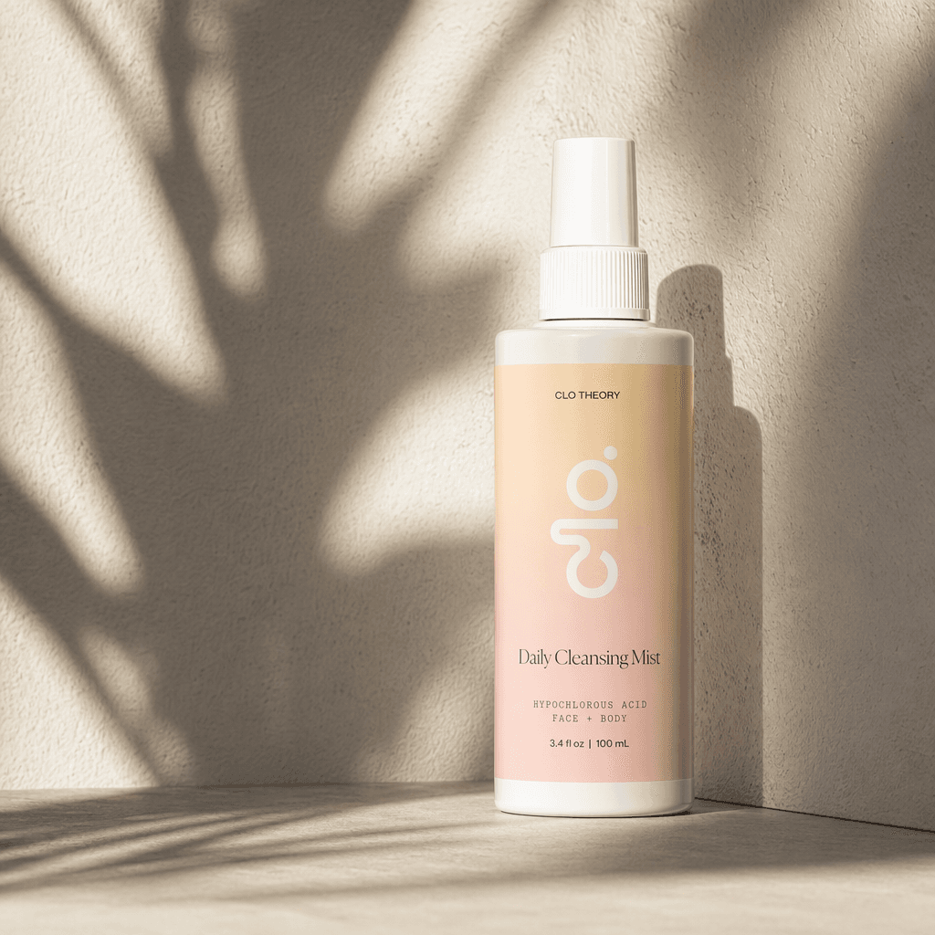 Clo Daily Cleansing Mist bottle against a soft pastel backdrop